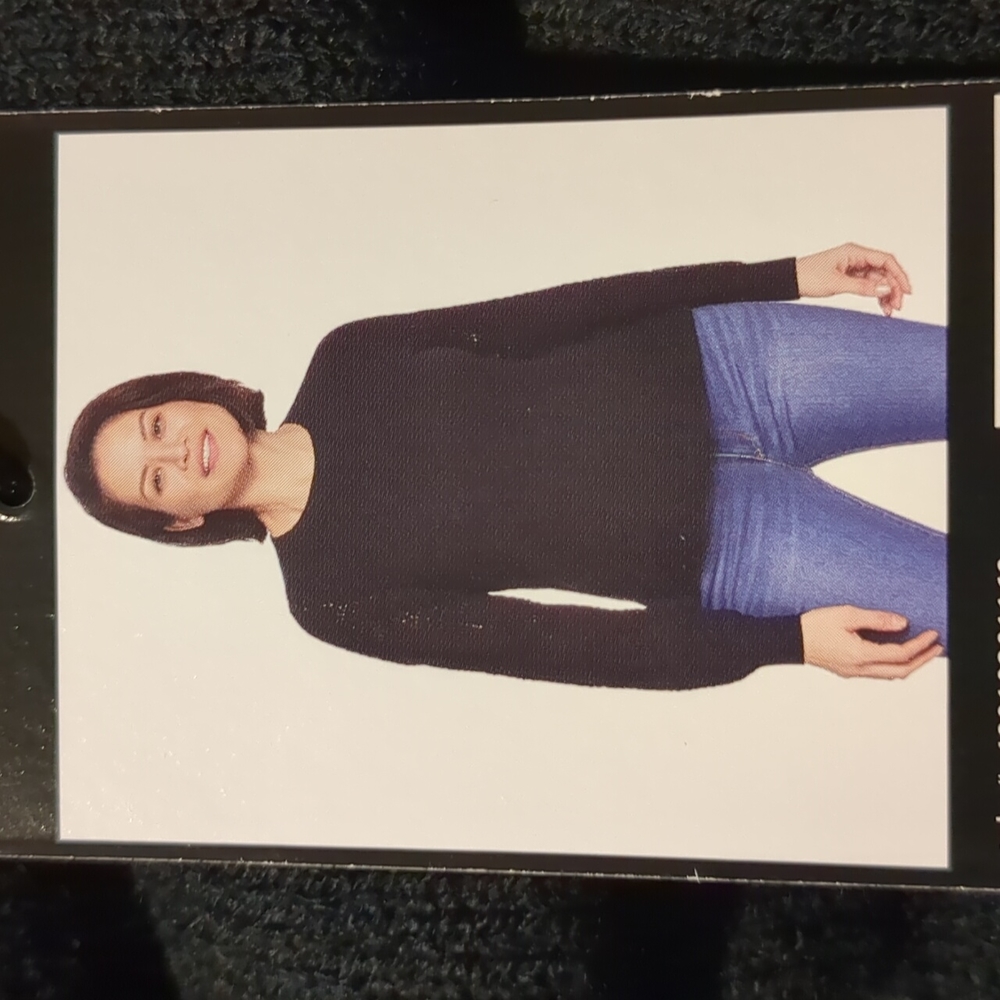 Black sweater by Christian Siriano